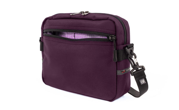 The Side Kick in Aubergine (dark purple) Ballistic with a Wisteria (pale purple with white grid) 200 Halcyon interior.